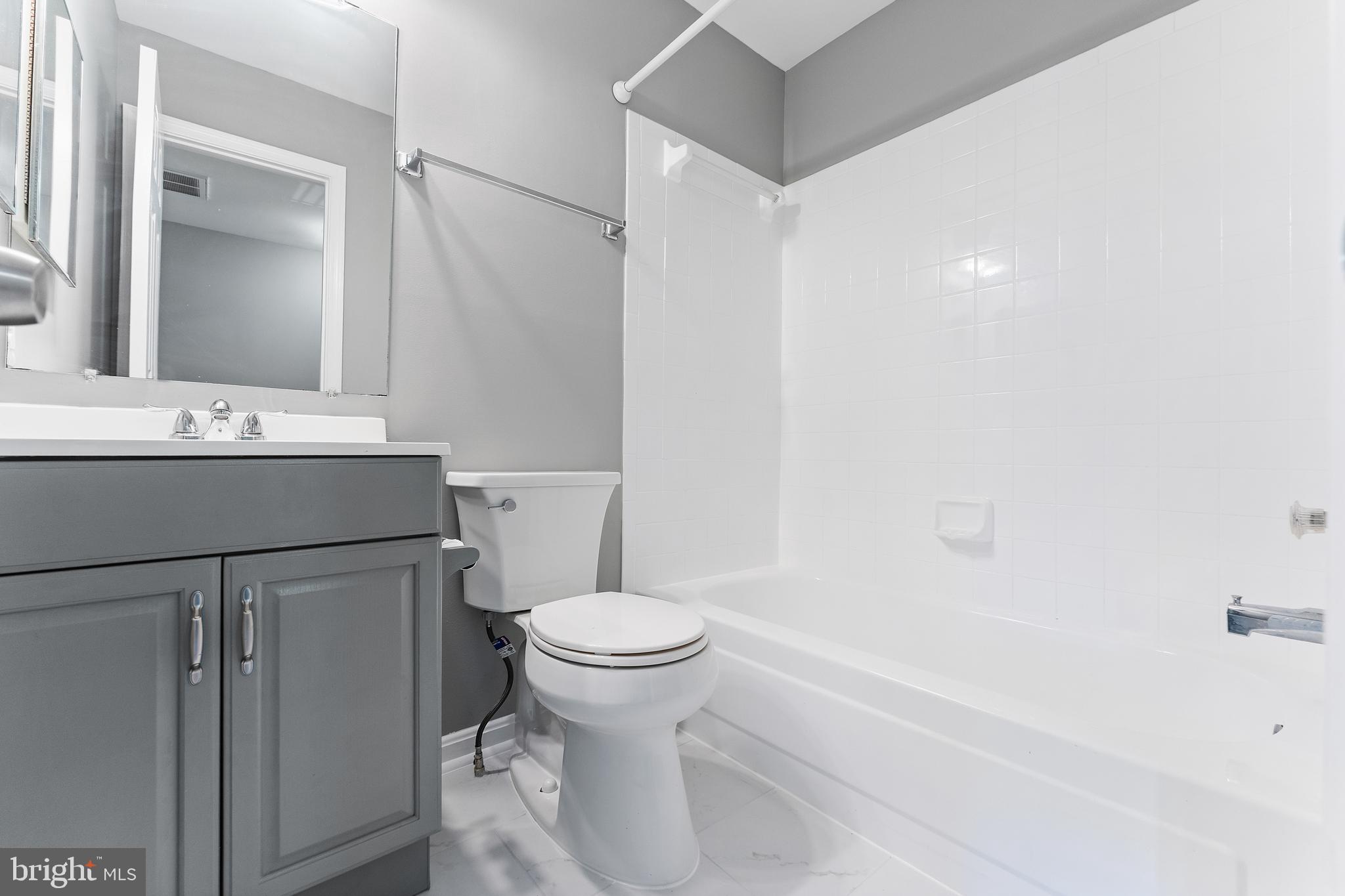 892 Smartts Lane Northeast Leesburg, VA 20176 - Photo 11 of 23 a bathroom with a sink toilet and shower