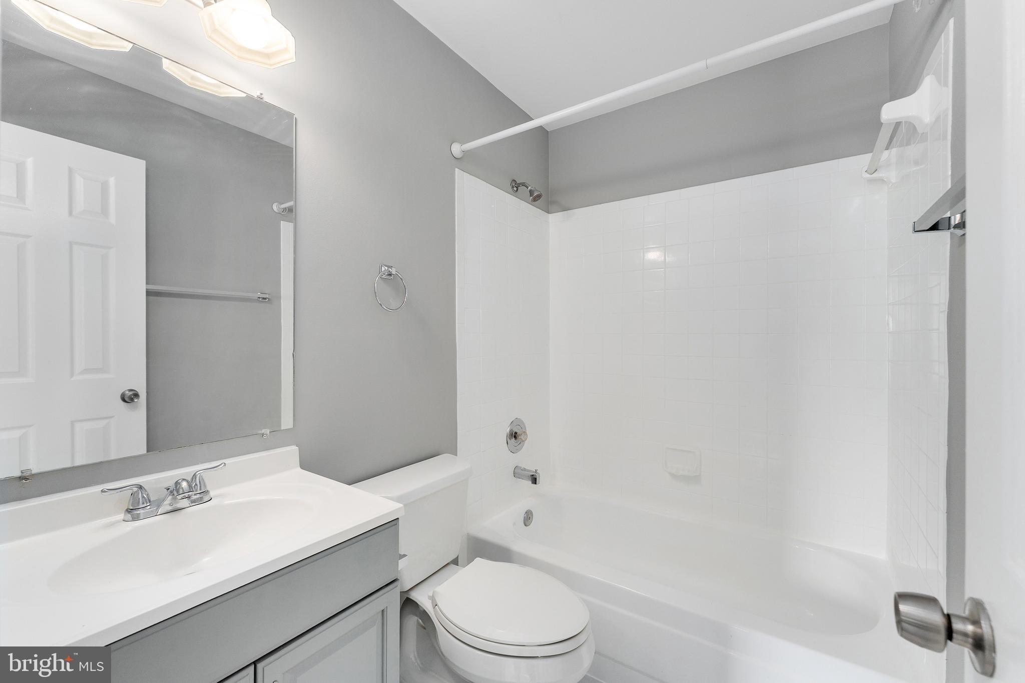 892 Smartts Lane Northeast Leesburg, VA 20176 - Photo 15 of 23 a bathroom with a sink toilet and shower