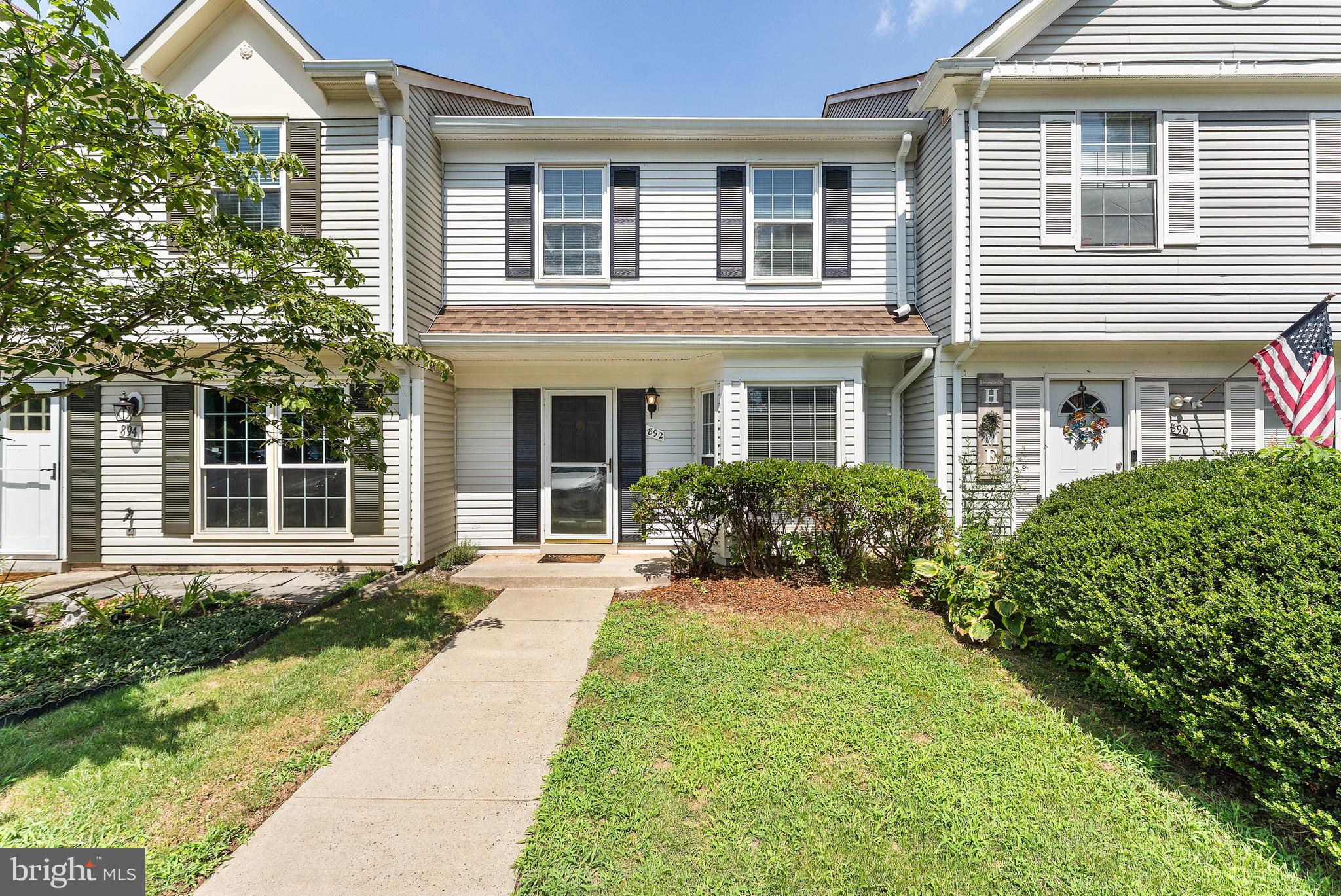 892 Smartts Lane Northeast Leesburg, VA 20176 - Photo 2 of 23 front view of a house with a yard