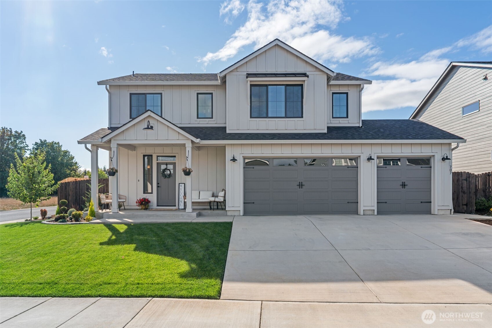 a front view of a house with a yard