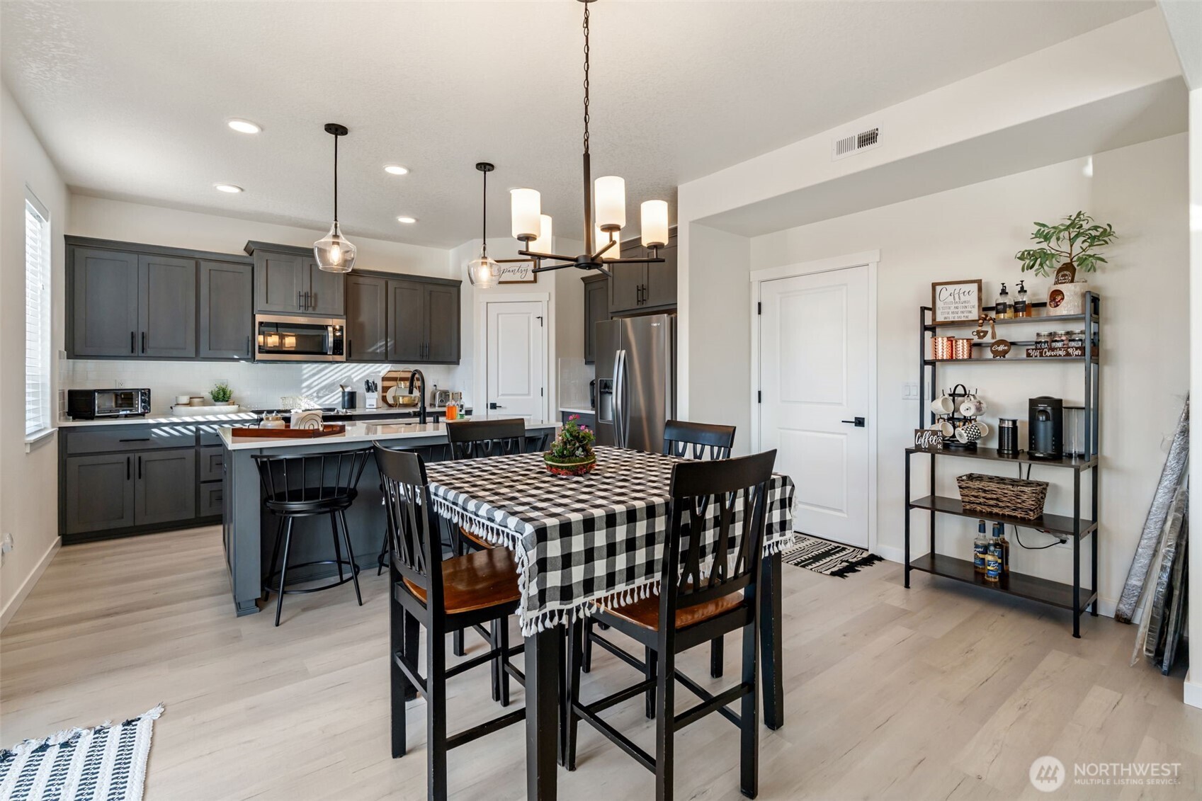 707 Cardinal Avenue Winlock, WA 98596 - Photo 12 of 36 a kitchen with kitchen island a dining table and chairs