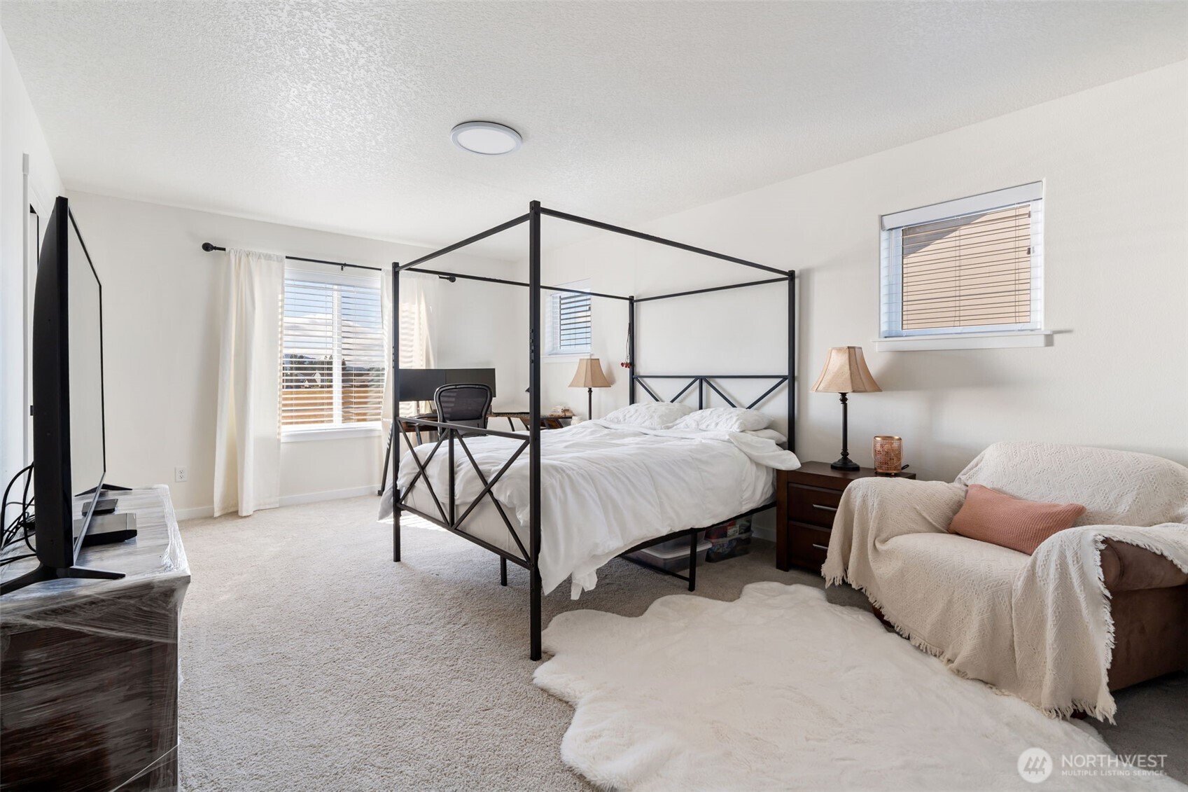 707 Cardinal Avenue Winlock, WA 98596 - Photo 17 of 36 a bedroom with a bed couch and a window