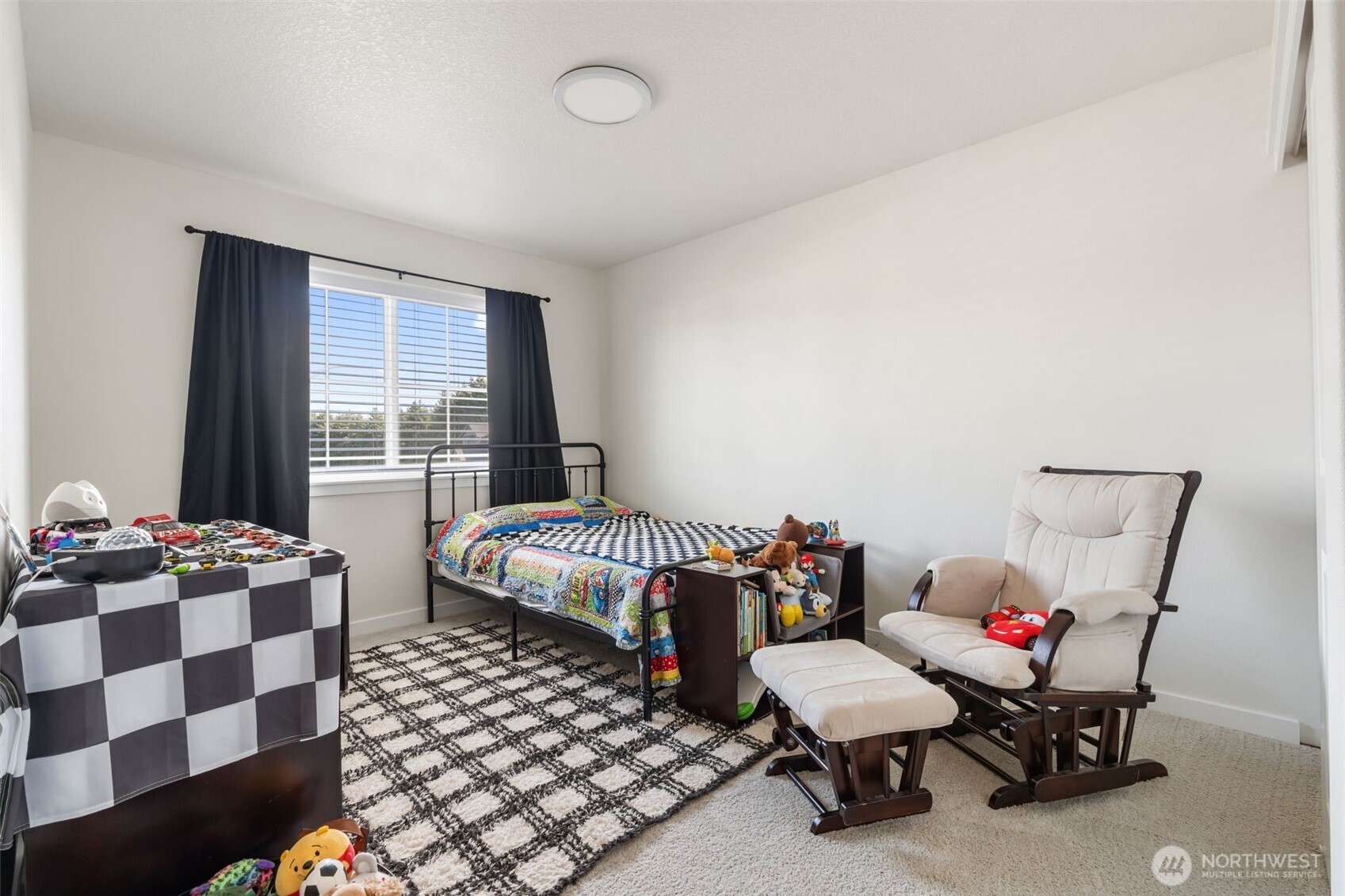 707 Cardinal Avenue Winlock, WA 98596 - Photo 20 of 36 a bedroom with a bed and wooden floor