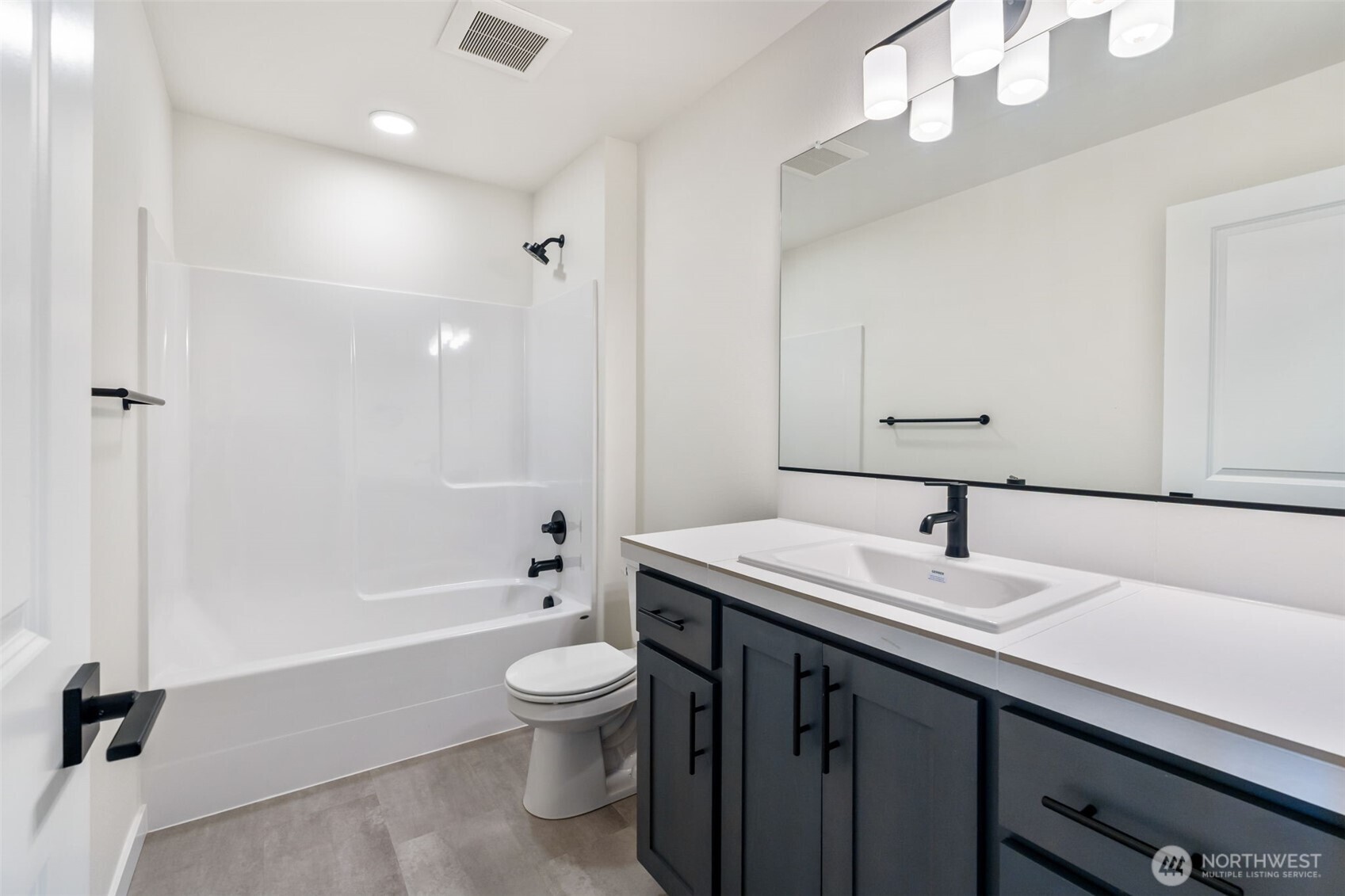 707 Cardinal Avenue Winlock, WA 98596 - Photo 21 of 36 a bathroom with a sink a toilet and shower
