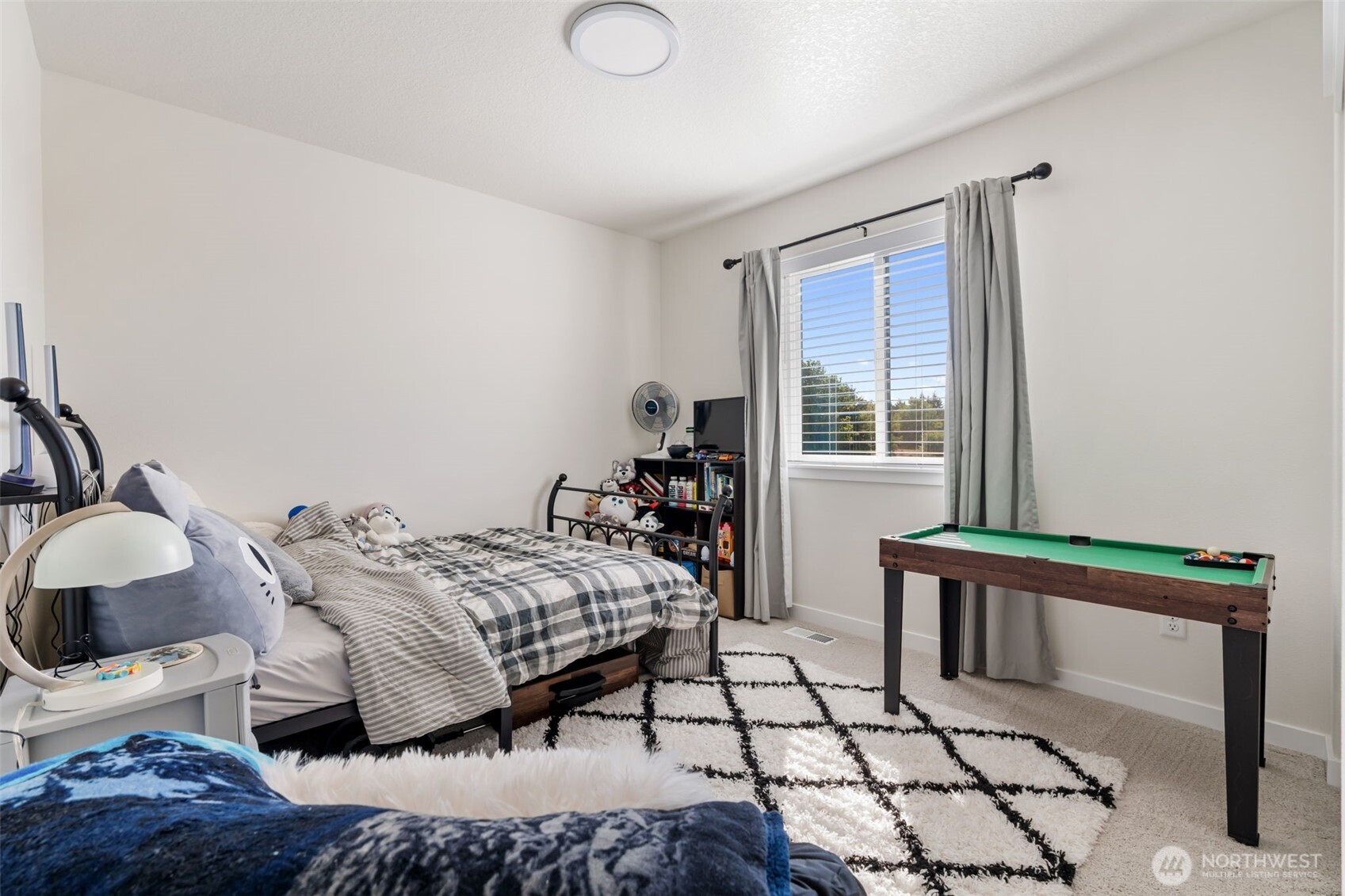707 Cardinal Avenue Winlock, WA 98596 - Photo 22 of 36 a bedroom with a bed and a window