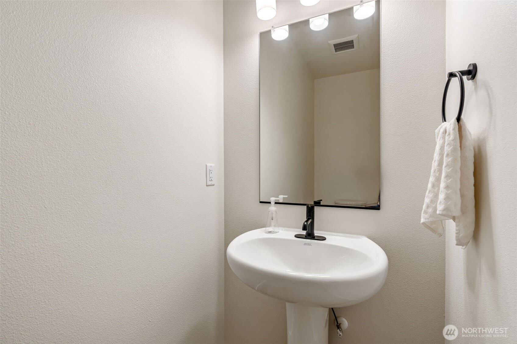 707 Cardinal Avenue Winlock, WA 98596 - Photo 24 of 36 a bathroom with a sink a mirror and shower