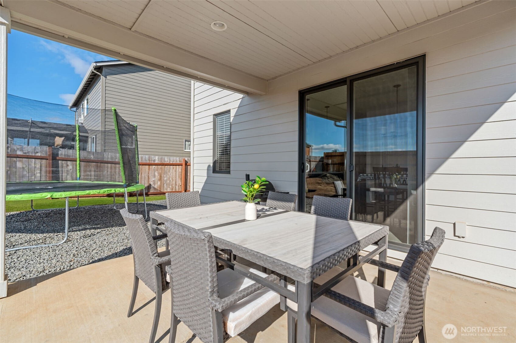 707 Cardinal Avenue Winlock, WA 98596 - Photo 26 of 36 a patio with a table and chairs and potted plants