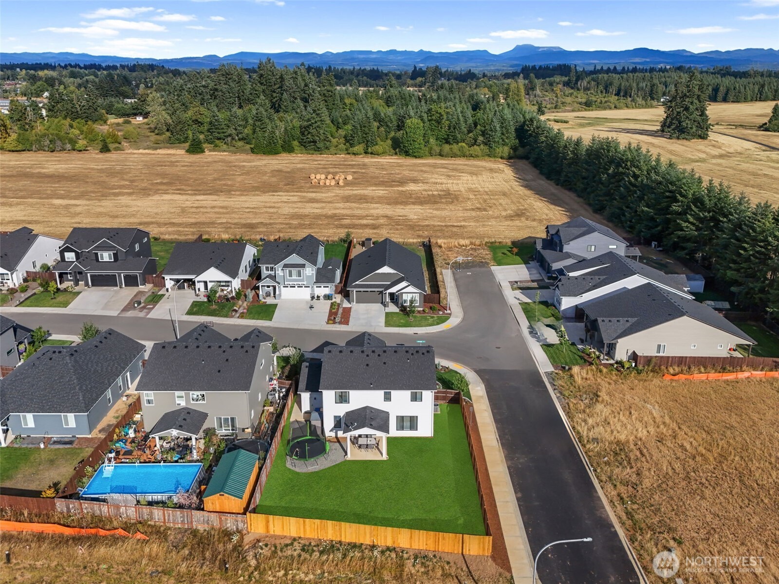 707 Cardinal Avenue Winlock, WA 98596 - Photo 30 of 36 a view of a swimming pool with an ocean view