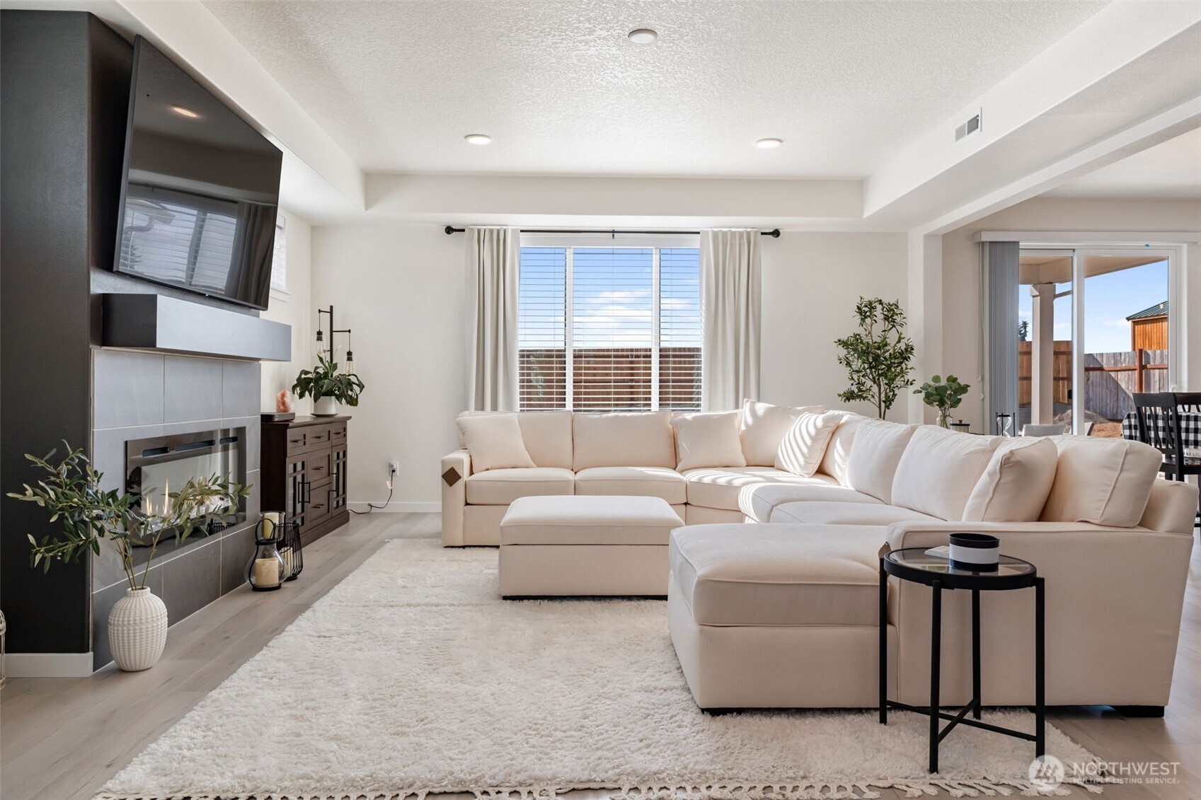 707 Cardinal Avenue Winlock, WA 98596 - Photo 5 of 36 a living room with furniture fireplace and a large window