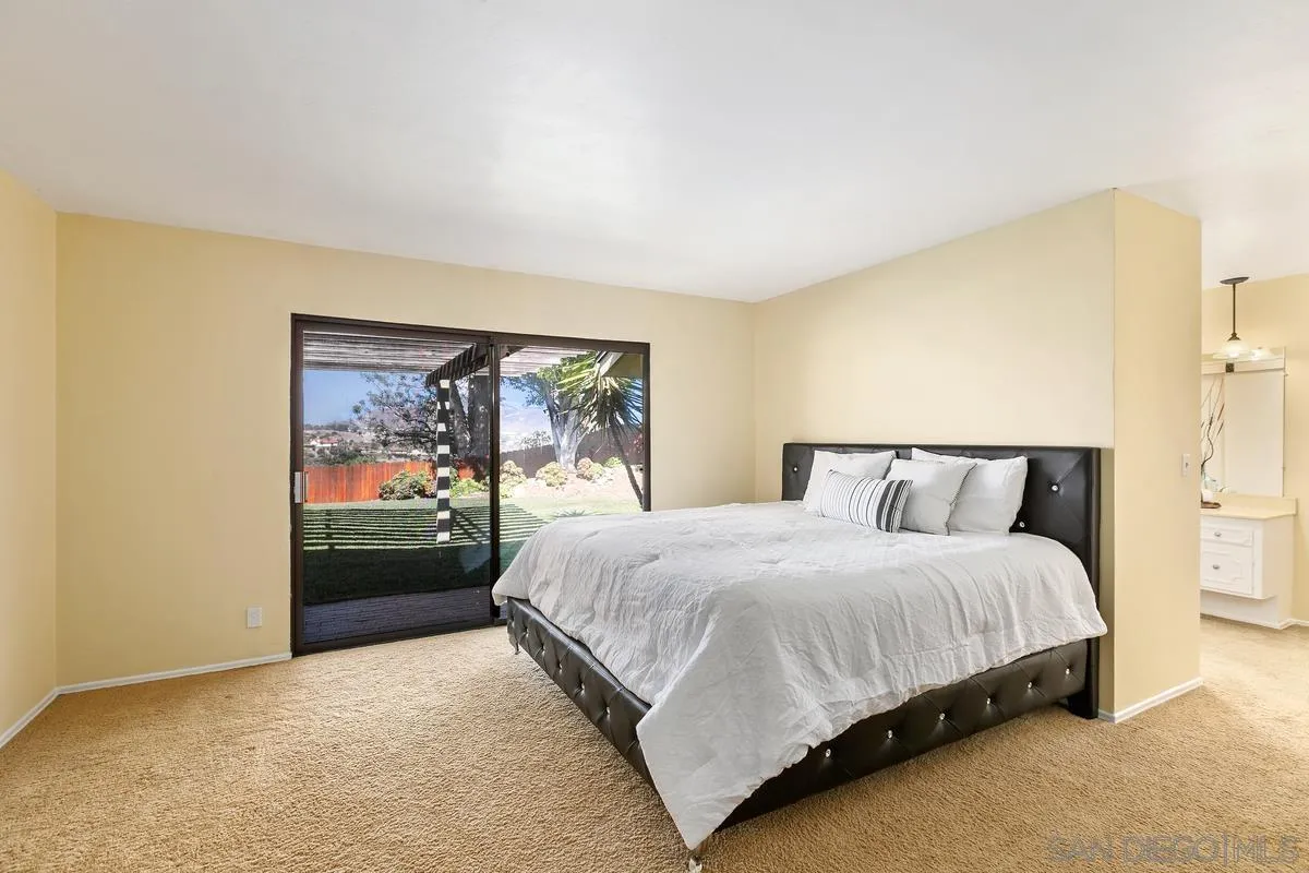 2075 Windmill View Road El Cajon, CA 92020 - Photo 24 of 34 a bedroom with a bed and a painting on the wall