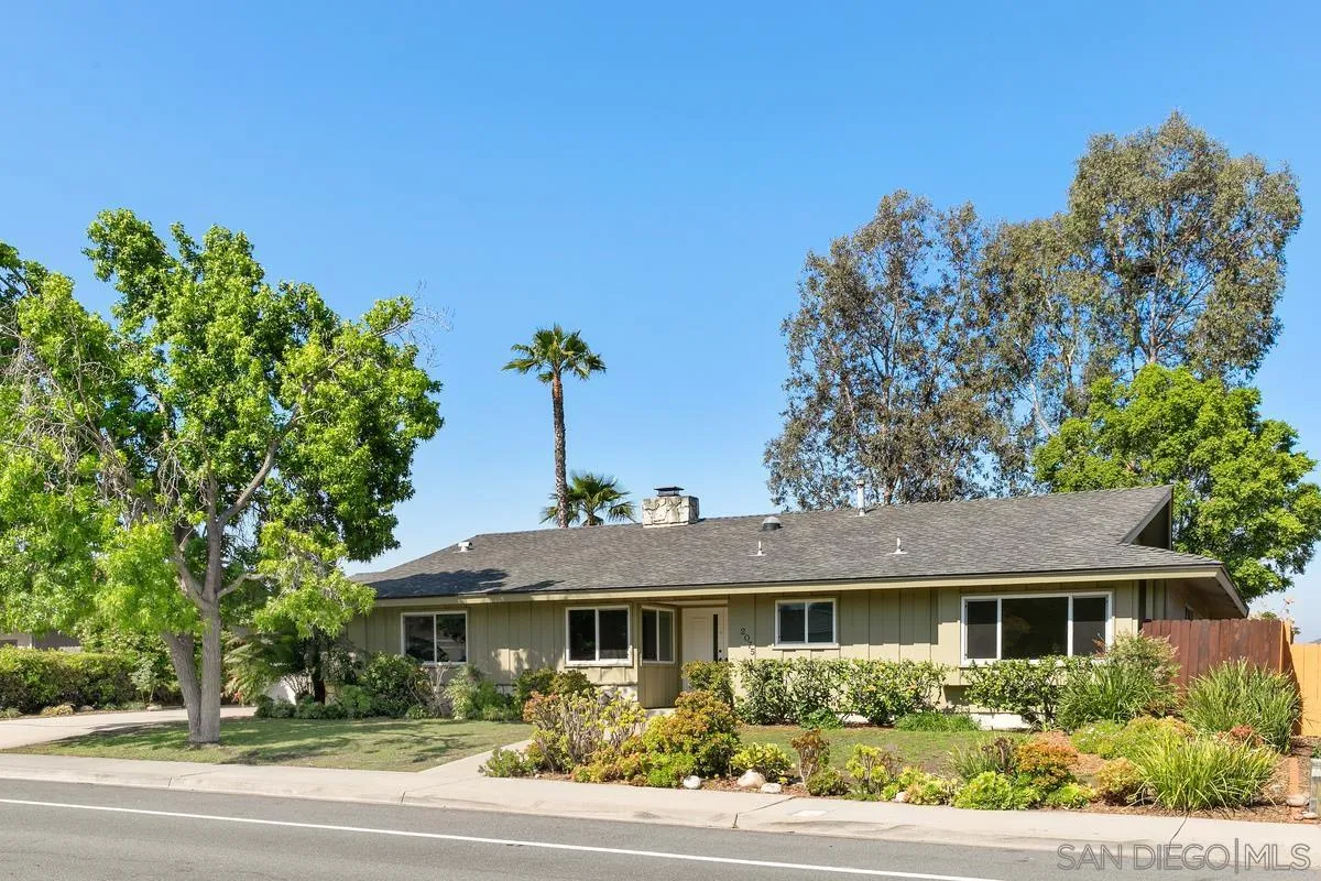 2075 Windmill View Road El Cajon, CA 92020 - Photo 4 of 34 a front view of a house with a yard