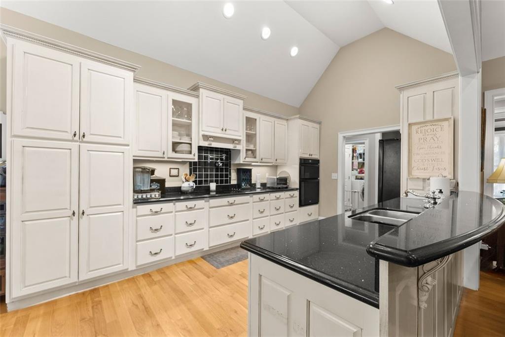 7269 Sloan Stephens Road Alto, GA 30510 - Photo 13 of 70 a kitchen with stainless steel appliances granite countertop a sink a stove and cabinets