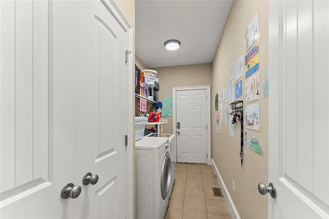a front view of a house with a yard table and chairs