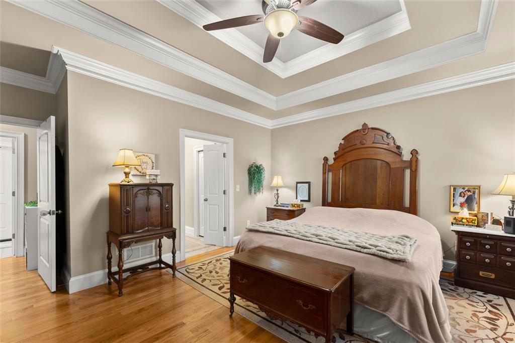 7269 Sloan Stephens Road Alto, GA 30510 - Photo 23 of 70 a bedroom with a bed and wooden floor
