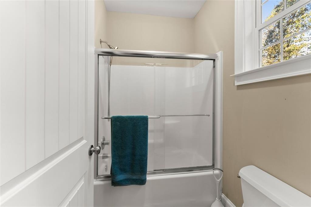 7269 Sloan Stephens Road Alto, GA 30510 - Photo 32 of 70 a bathroom with a shower and a toilet