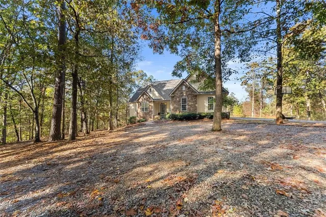 a kitchen with stainless steel appliances granite countertop a sink a stove and cabinets