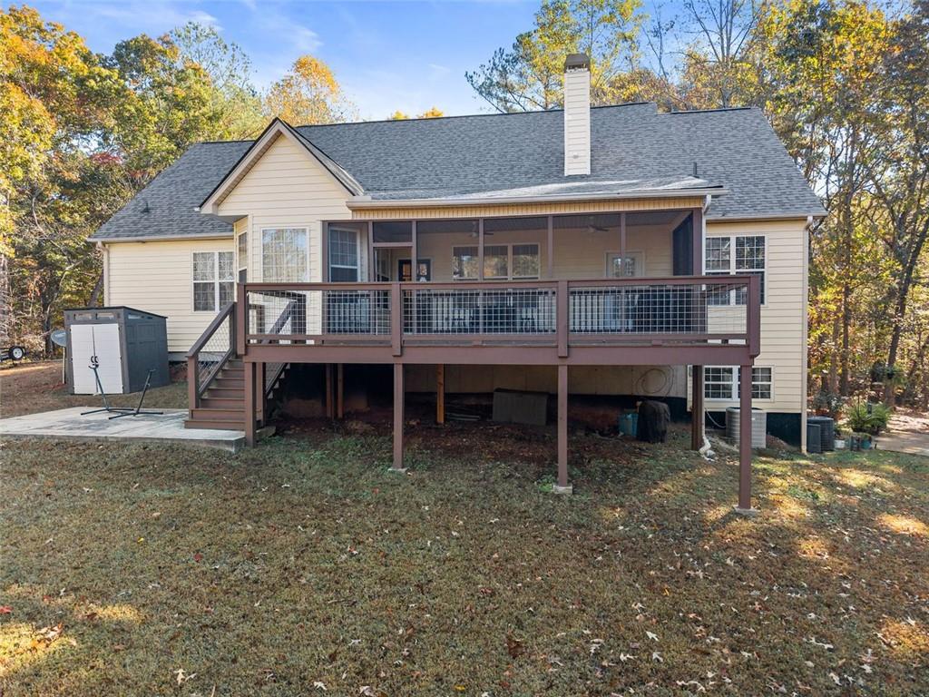 7269 Sloan Stephens Road Alto, GA 30510 - Photo 58 of 70 a view of a house with a yard and sitting area