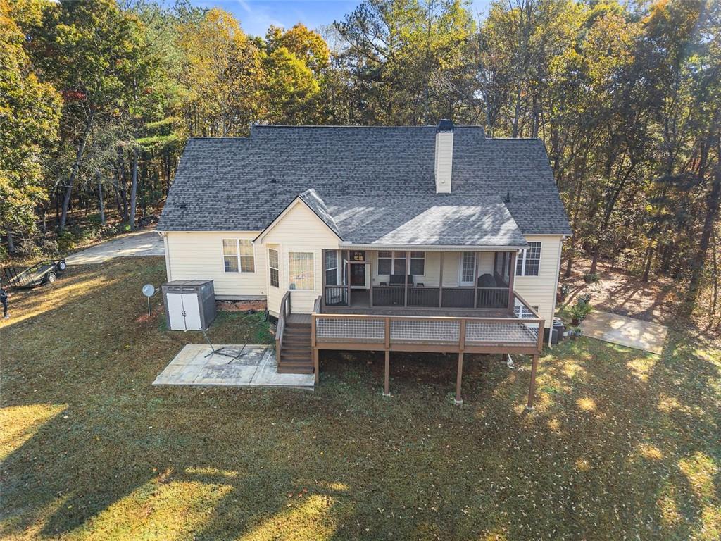 7269 Sloan Stephens Road Alto, GA 30510 - Photo 60 of 70 a front view of a house with a yard table and chairs