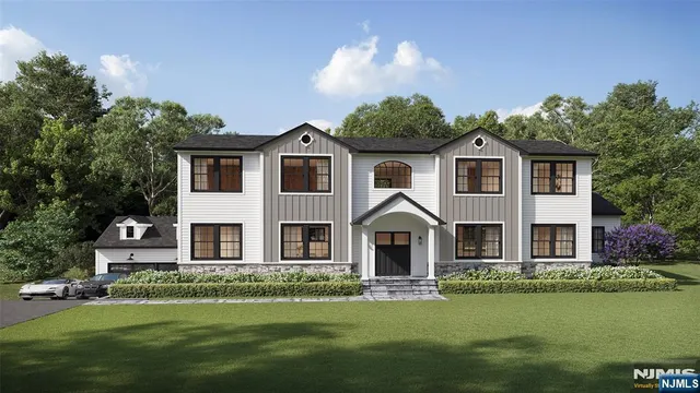 a front view of a house with a garden and plants