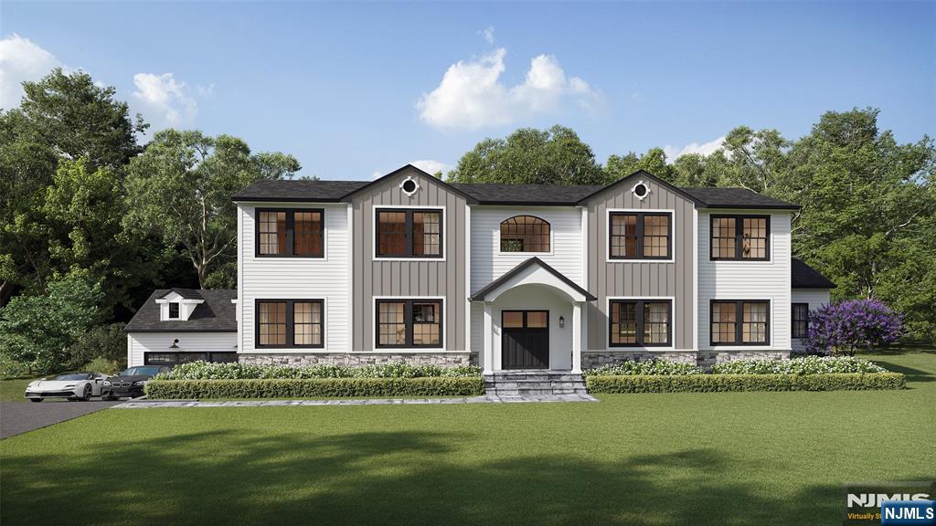 a front view of a house with a garden and plants