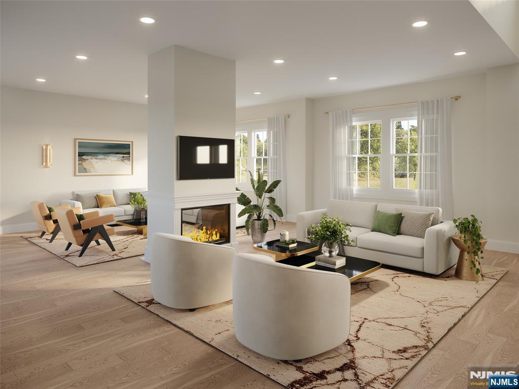 42 Werimus Road Woodcliff Lake, NJ 07677 - Photo 3 of 11 a living room with fireplace furniture and a flat screen tv