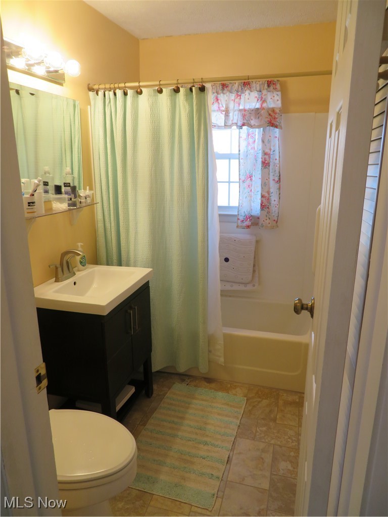 4358 Buss Road Wooster, OH 44691 - Photo 23 of 24 Bathroom with toilet, shower / tub combo, and vanity