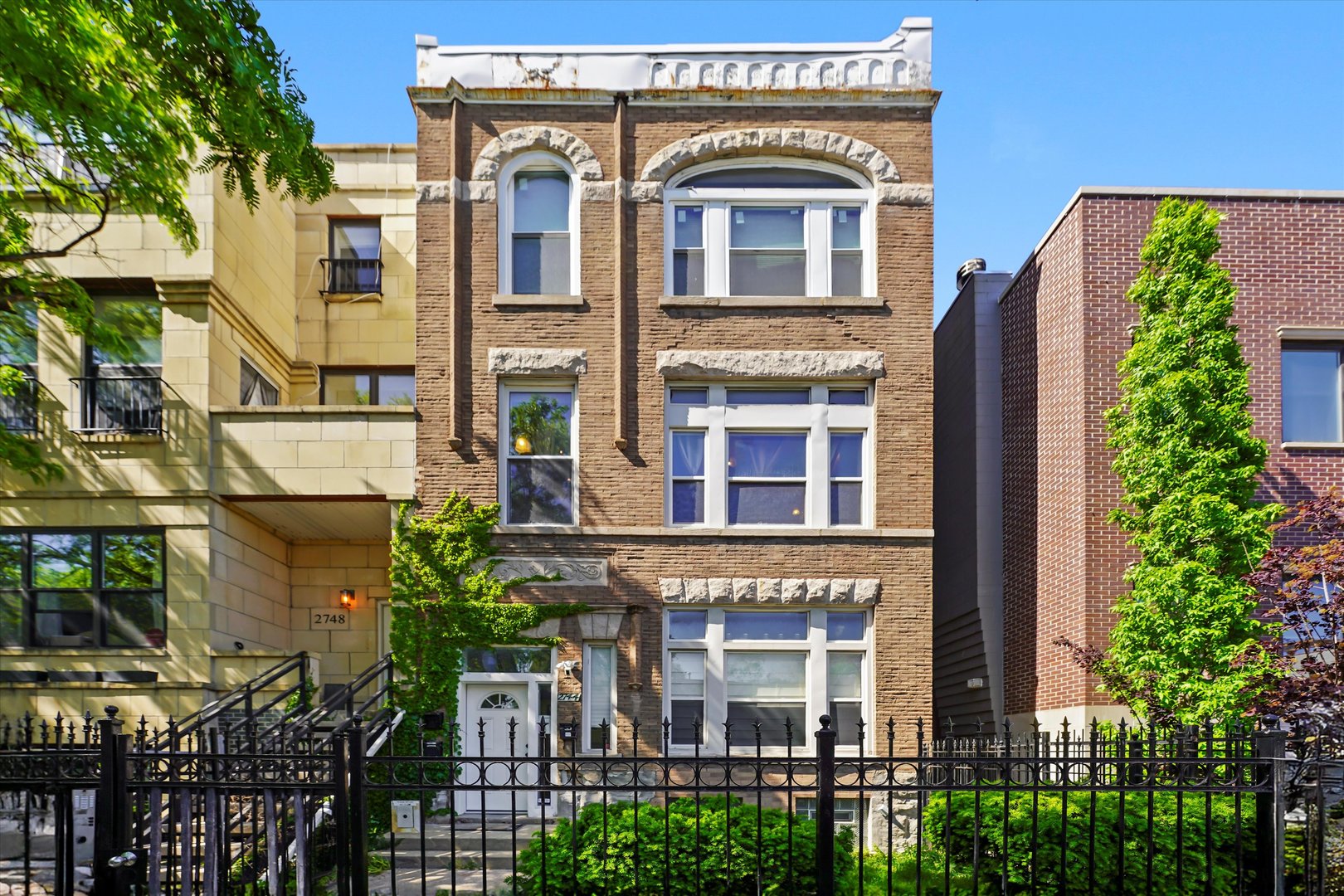 2744 West Haddon Avenue, Unit 2 Chicago, IL 60622 - Photo 1 of 22 a front view of a multi story residential apartment building