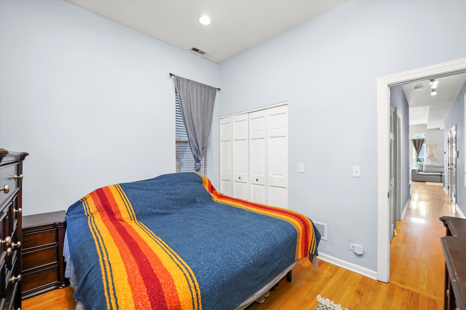 2744 West Haddon Avenue, Unit 2 Chicago, IL 60622 - Photo 13 of 22 a bedroom with a bed and wooden floor