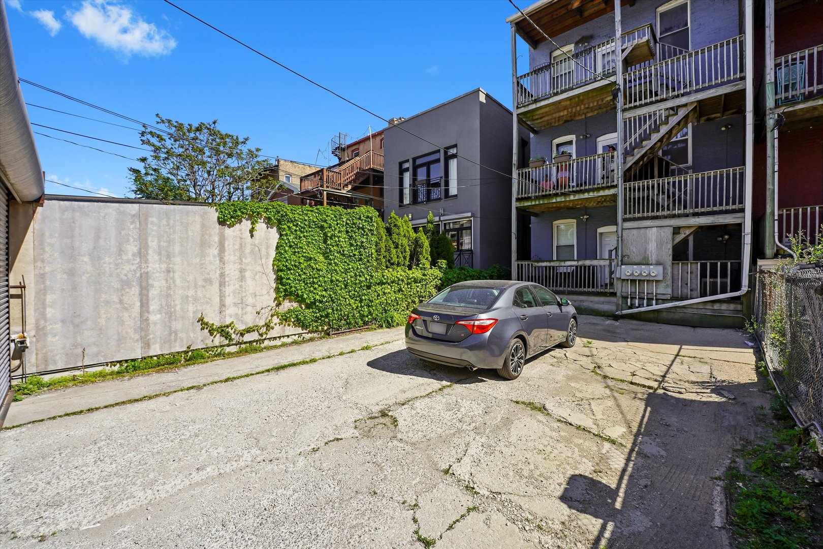 2744 West Haddon Avenue, Unit 2 Chicago, IL 60622 - Photo 19 of 22 a yellow house with trees in front of it