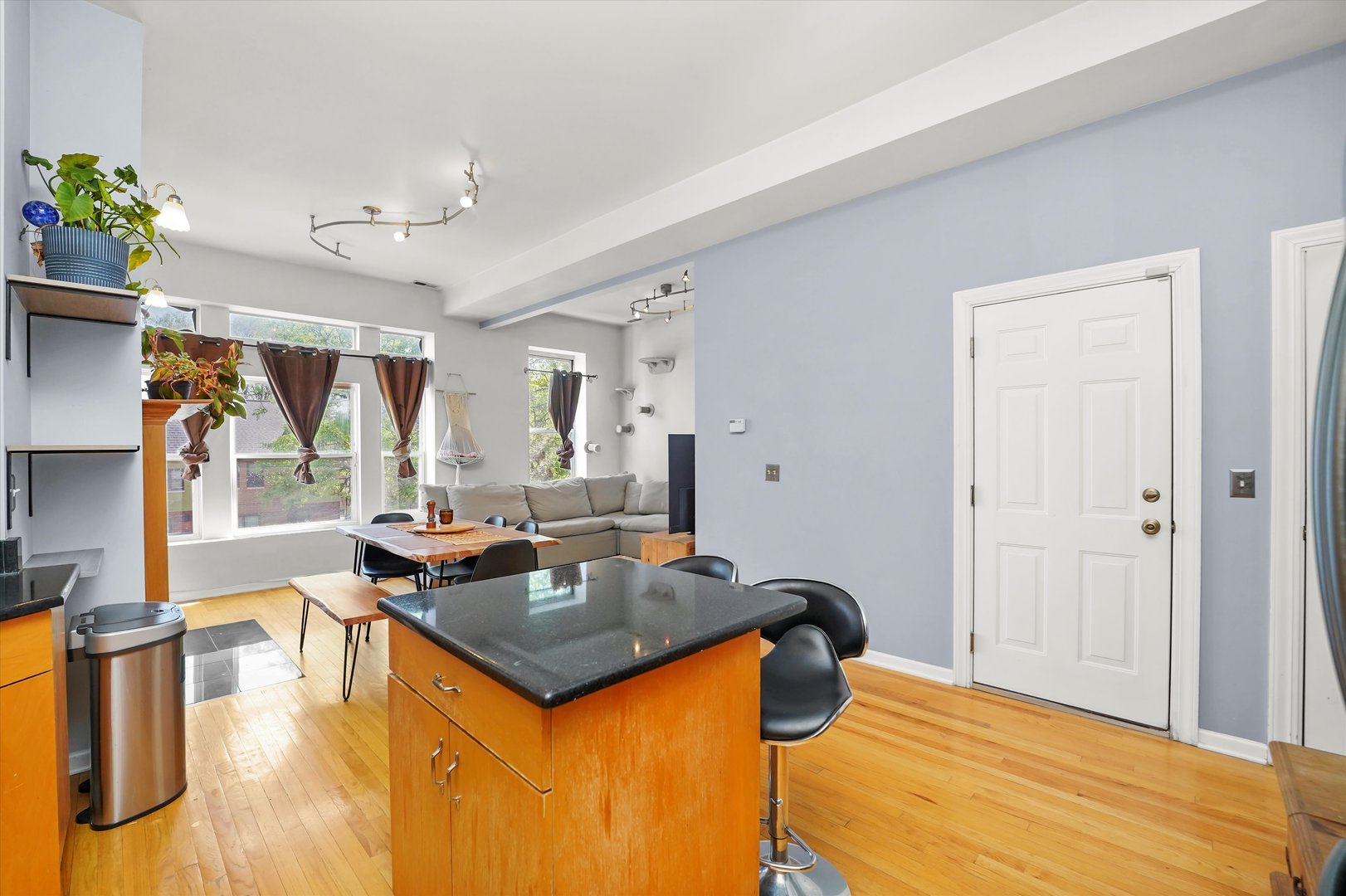 2744 West Haddon Avenue, Unit 2 Chicago, IL 60622 - Photo 4 of 22 a view of a dining room with furniture and a chandelier