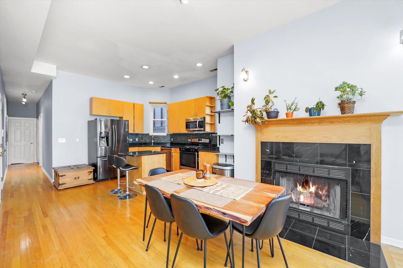 2744 West Haddon Avenue, Unit 2 Chicago, IL 60622 - Photo 5 of 22 a view of a dining room with furniture and a fireplace