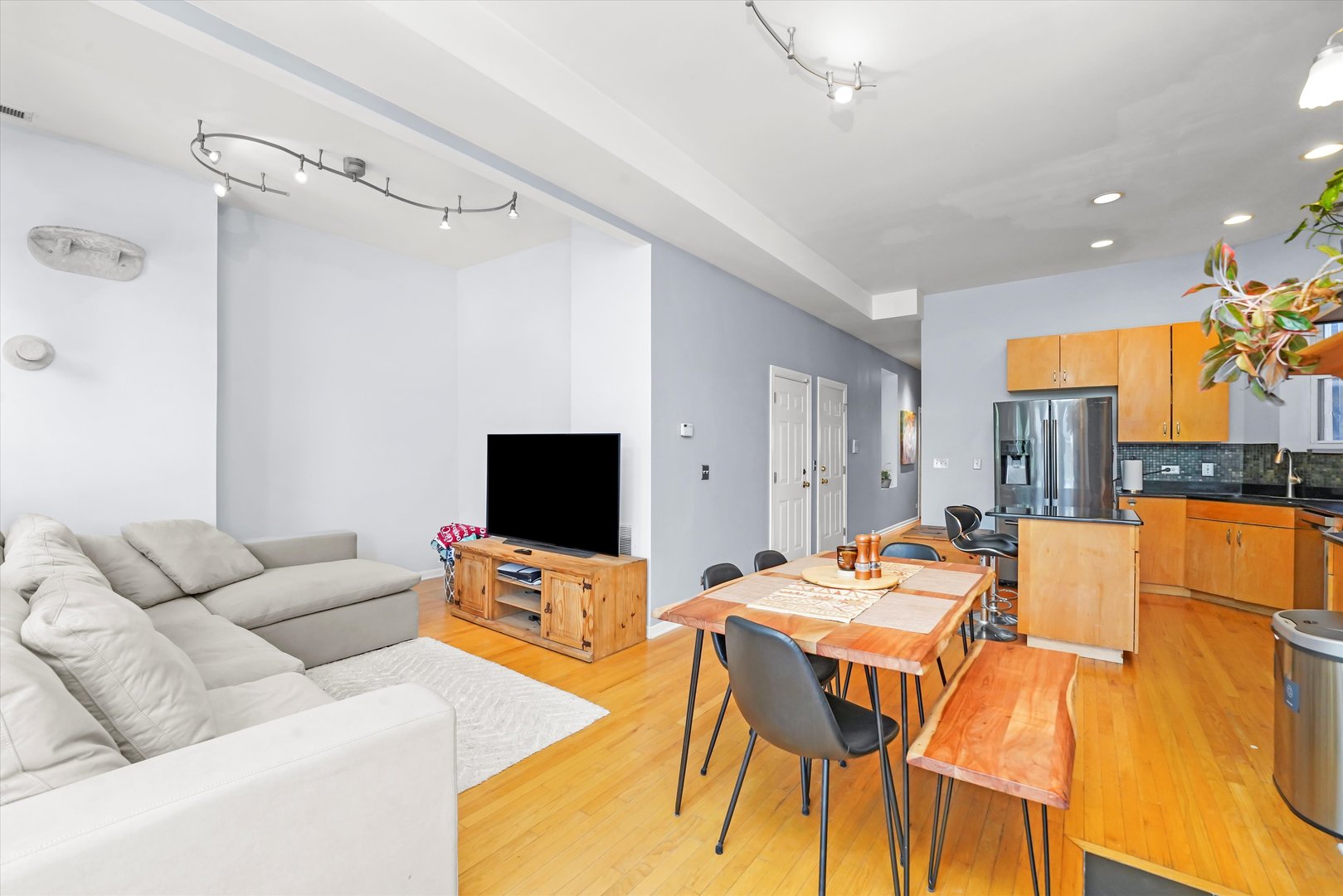 2744 West Haddon Avenue, Unit 2 Chicago, IL 60622 - Photo 7 of 22 a living room with furniture and a flat screen tv