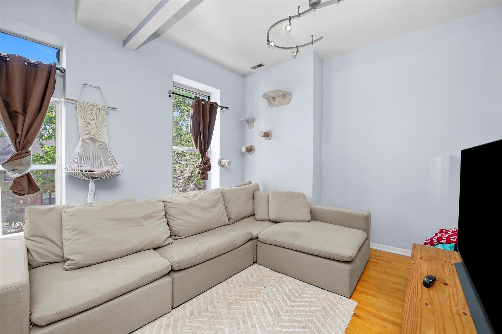 2744 West Haddon Avenue, Unit 2 Chicago, IL 60622 - Photo 8 of 22 a living room with furniture and a flat screen tv