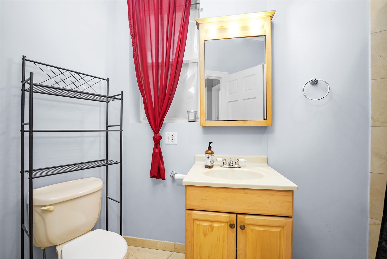2744 West Haddon Avenue, Unit 2 Chicago, IL 60622 - Photo 10 of 22 a bathroom with a sink vanity mirror and toilet