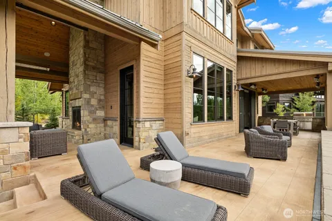 a view of a patio with couches and potted plants