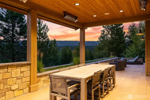 a view of an outdoor dining space with furniture