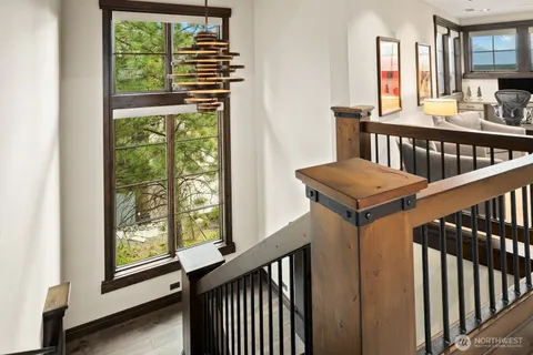 a view of a balcony with furniture and stairs