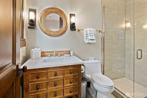 a bathroom with a sink toilet and shower