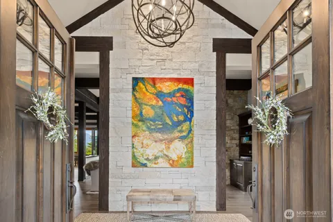 a view of fireplace with paintings on the wall