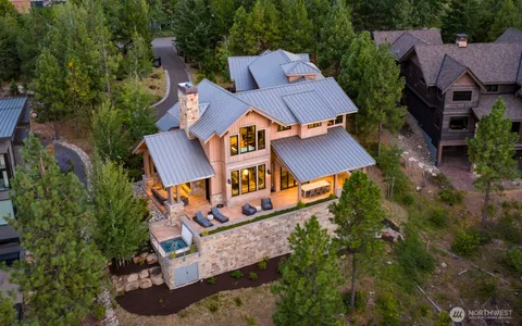 an aerial view of a house with garden space and street view