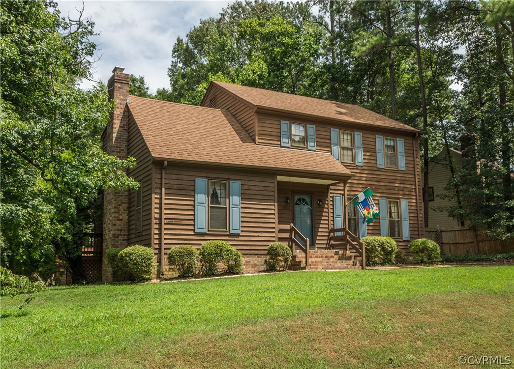 2901 Brookforest Road Midlothian, VA 23112 - Photo 1 of 29 a front view of a house with a garden