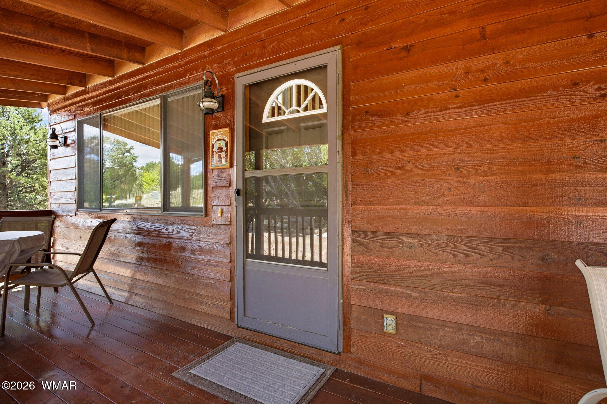 2806 Sky Hawk Drive Overgaard, AZ 85933 - Photo 8 of 43 a view of a chairs and table on the wooden floor