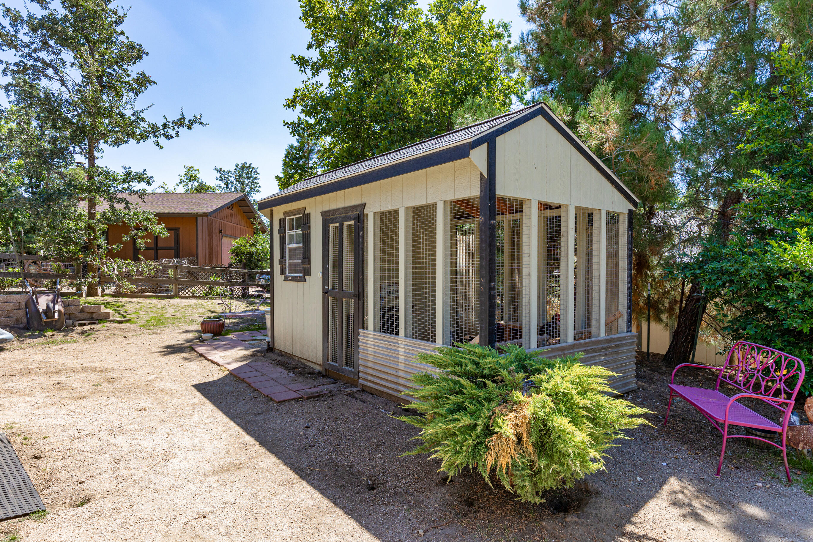 26901 Bear Valley Road Tehachapi, CA 93561 - Photo 50 of 62 a view of a house with backyard and sitting area