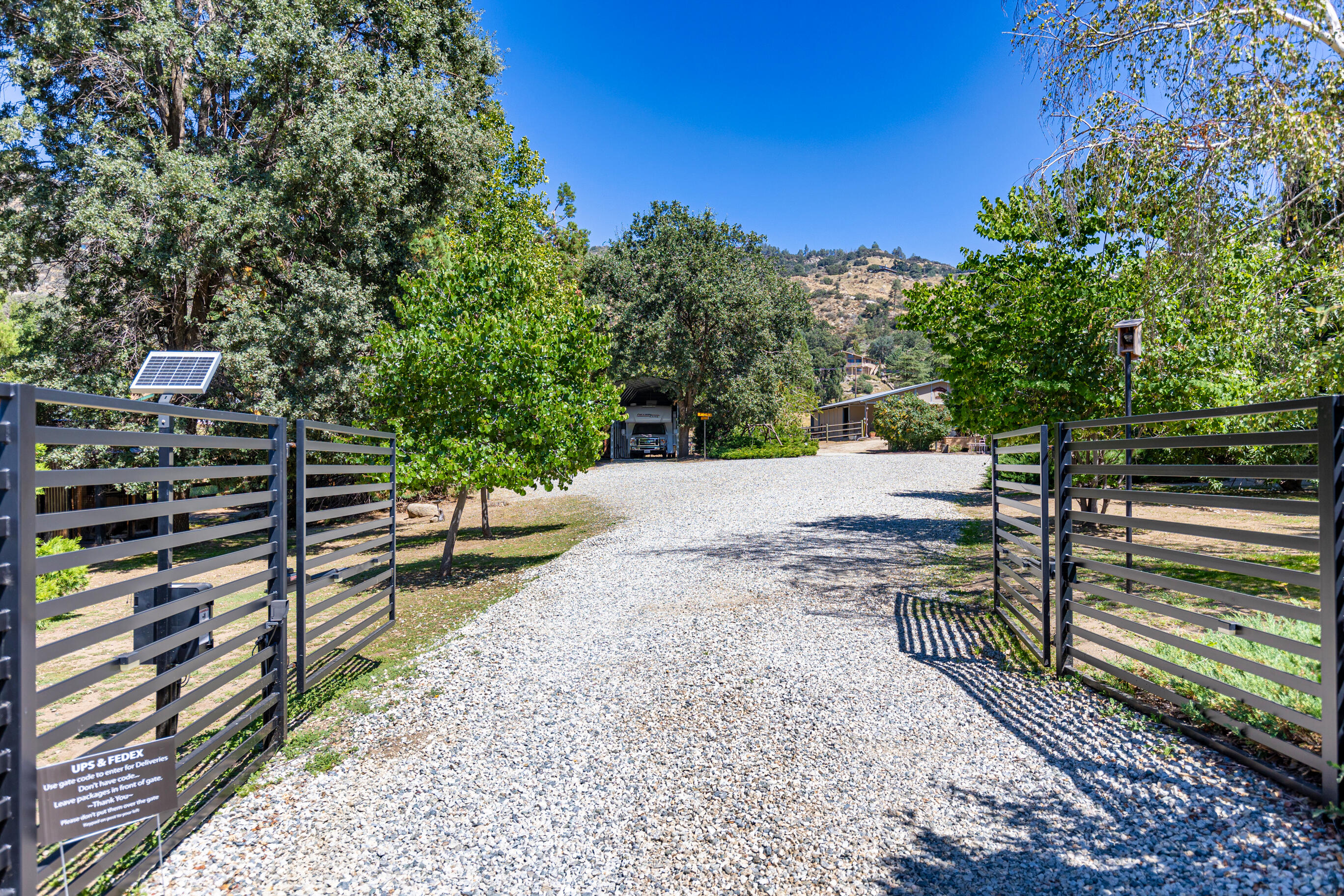 26901 Bear Valley Road Tehachapi, CA 93561 - Photo 6 of 62 a view of a yard with potted plants