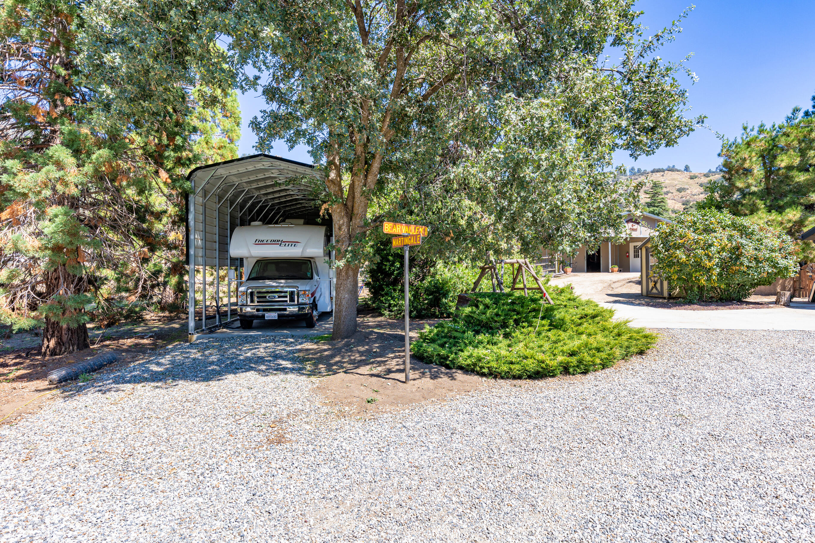 26901 Bear Valley Road Tehachapi, CA 93561 - Photo 10 of 62 a view of a house with a yard and sitting area