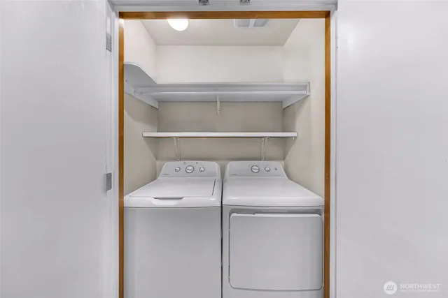 a utility room with washer and dryer