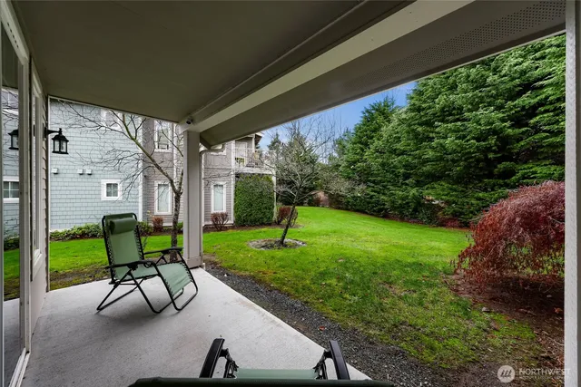a view of yard with patio