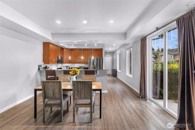 a view of a dining room with furniture window and wooden floor