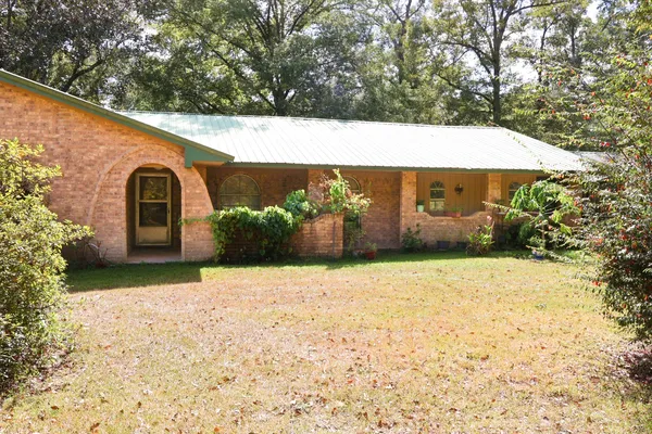 a view of a back yard with an outdoor space