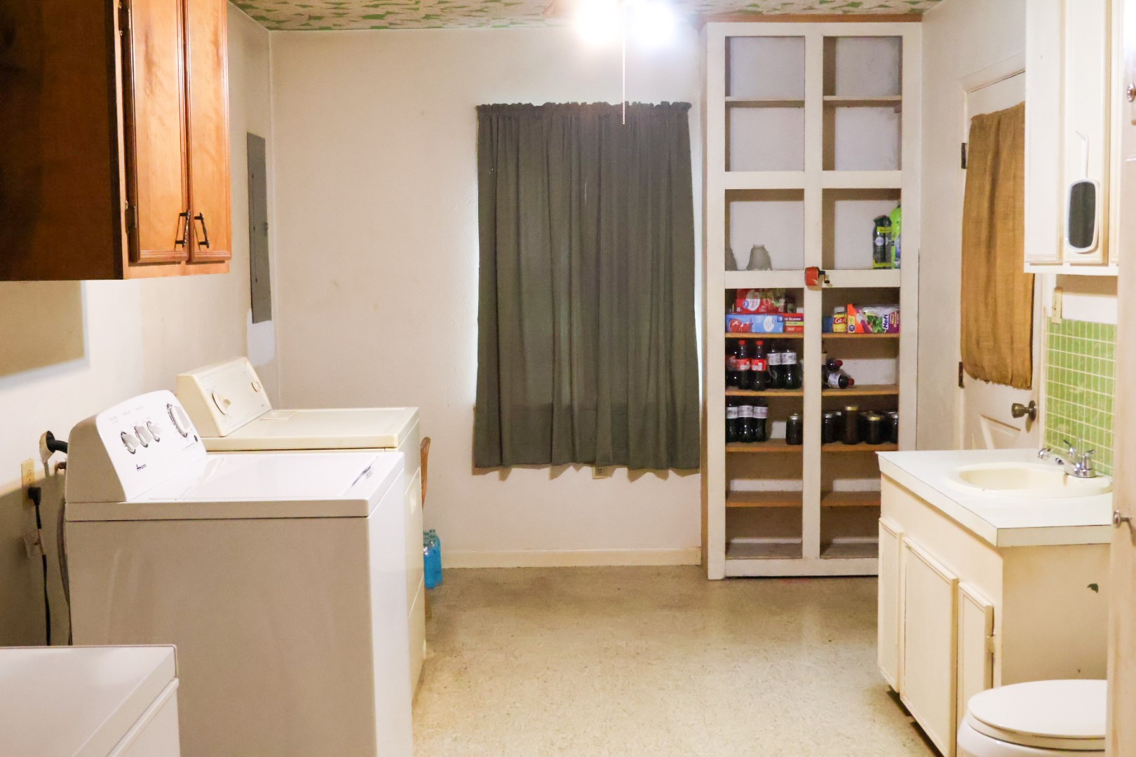 3680 Holly Grove Road Livingston, TX 77351 - Photo 5 of 24 a view of storage and utility room with washer and dryer
